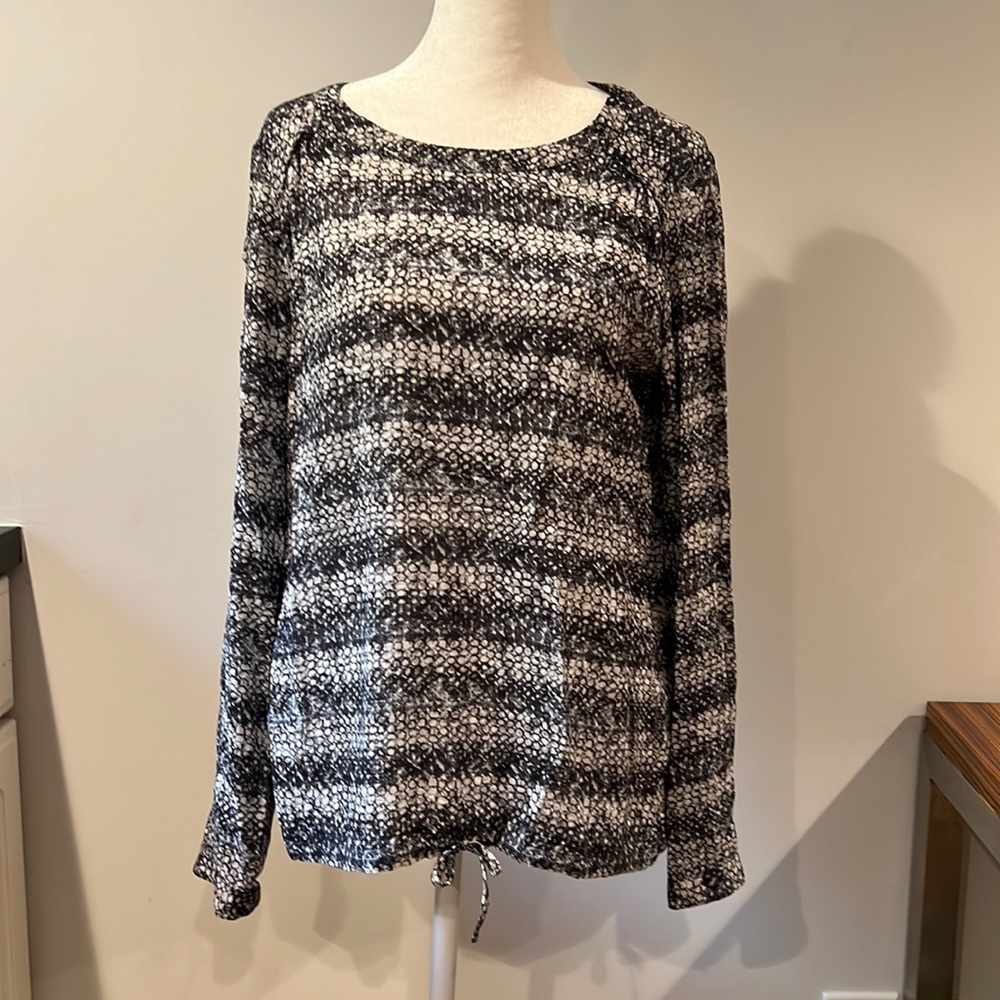 Navy and white patterned blouse